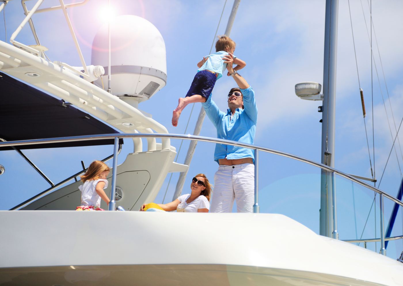 A family on the deck of a yacht