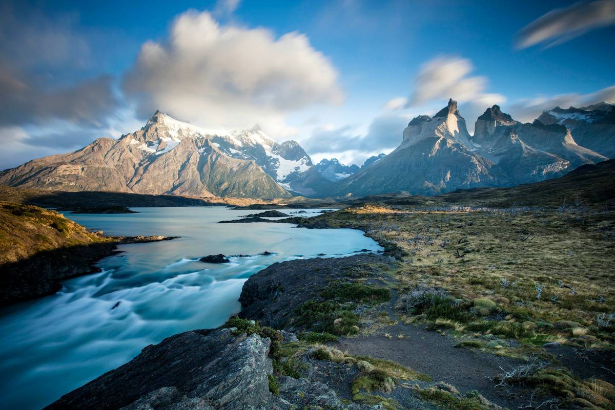 Snow-capped peaks above a glacial river